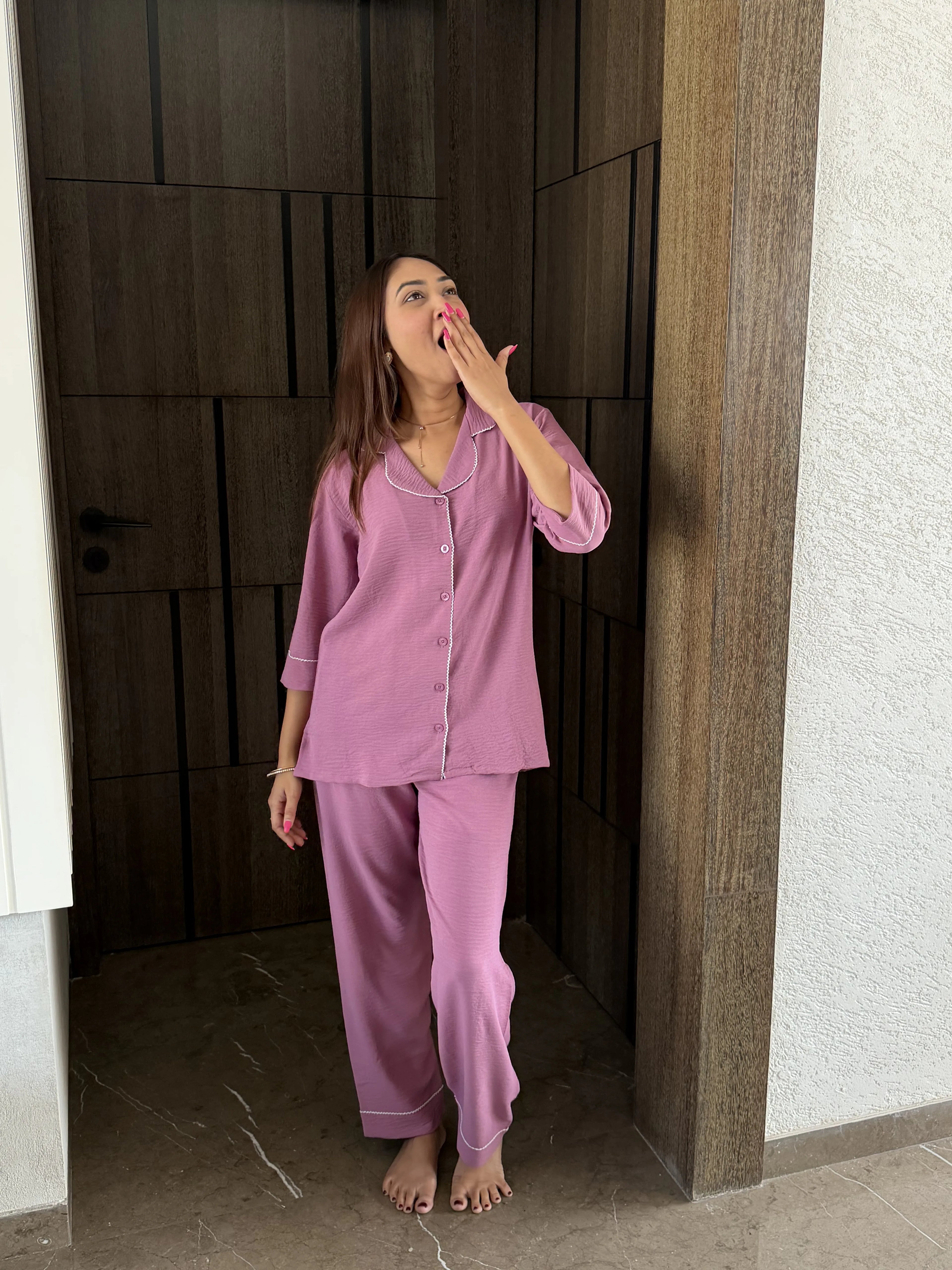 woman wearing velure crush cotton set looking relaxed and yawning 