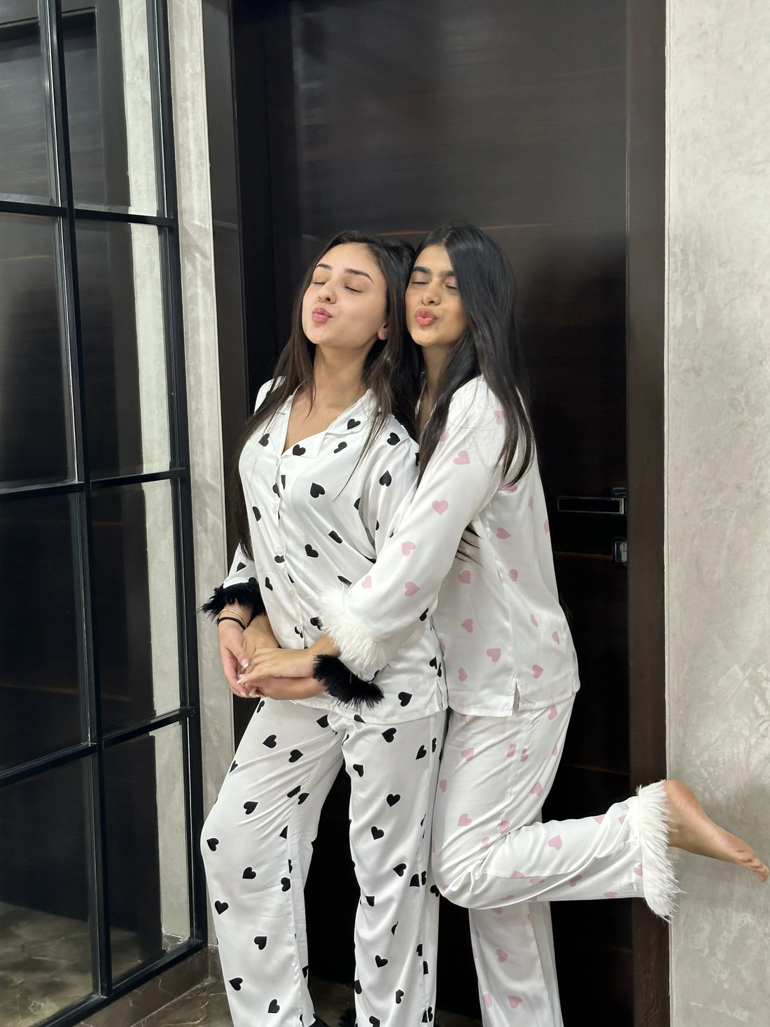 2 girls wearing Velure satin fur night suits and enjoying a sleepover. 