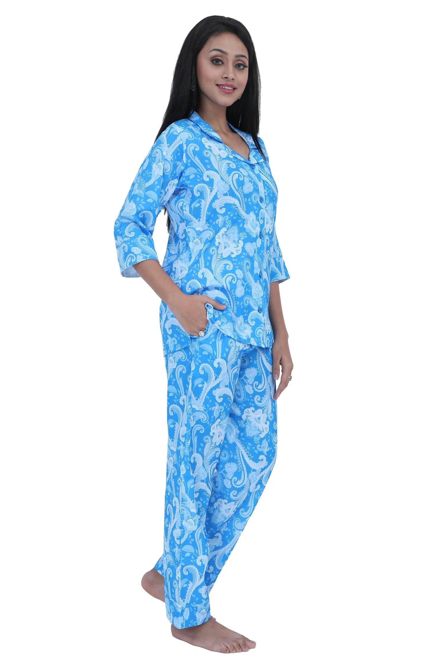 Velure Blue Paisley Print Satin Set - Velure, Shirt and Pant, Elevate your sleepwear wardrobe with Velure's Blue Paisley Print Satin Set. Crafted from luxurious satin material, this set boasts a chic geometric design, lending a touch of elegance to your bedtime ritual. It is equipped with a button-down top and elastic waistband for a comfortable and laid-back feel. Suitable for all seasons and effortless to care for, as it is machine washable.