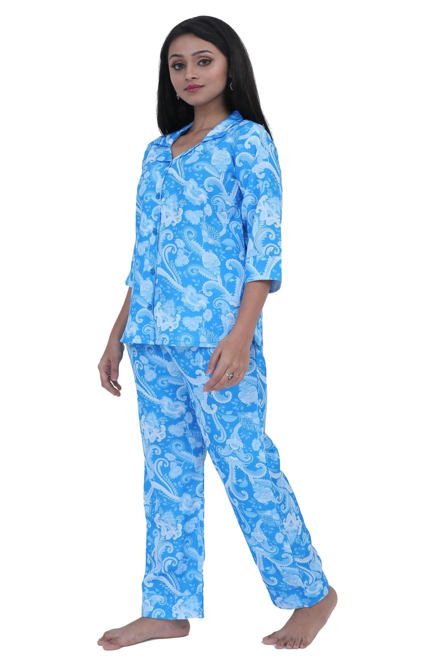 Velure Blue Paisley Print Satin Set - Velure, Shirt and Pant, Elevate your sleepwear wardrobe with Velure's Blue Paisley Print Satin Set. Crafted from luxurious satin material, this set boasts a chic geometric design, lending a touch of elegance to your bedtime ritual. It is equipped with a button-down top and elastic waistband for a comfortable and laid-back feel. Suitable for all seasons and effortless to care for, as it is machine washable.