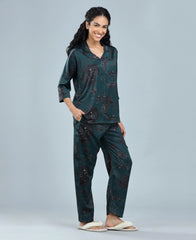 Velure Delightful Floral Satin Print Night Suit - Velure, Long Top and Pant, Elevate your weekend attire with Velure's Delightful Floral Satin Print Night Suit. Made from luxurious satin material, this set offers unparalleled comfort and softness. The dark green floral design brings a sense of cheer to the outfit. Including a 3/4 sleeve top and full-length pants with an elastic waistband, this suit guarantees a comfortably snug fit. Enjoy a peaceful night's rest accompanied by pleasant dreams.