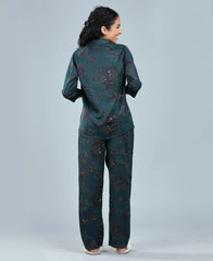 Velure Delightful Floral Satin Print Night Suit - Velure, Long Top and Pant, Elevate your weekend attire with Velure's Delightful Floral Satin Print Night Suit. Made from luxurious satin material, this set offers unparalleled comfort and softness. The dark green floral design brings a sense of cheer to the outfit. Including a 3/4 sleeve top and full-length pants with an elastic waistband, this suit guarantees a comfortably snug fit. Enjoy a peaceful night's rest accompanied by pleasant dreams.