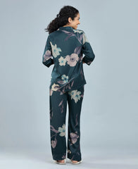 Velure Tropical Floral Satin Print Night Suit - Velure, Shirt and Pant, Indulge in luxury and relaxation with the Velure Tropical Floral Satin Print Night Suit. Crafted from premium satin material, this set showcases a stunning floral print. Included are a long-sleeved shirt and full-length pants with an elastic waistband, ensuring a perfect fit. Ideal for peaceful slumber or leisurely lounging.